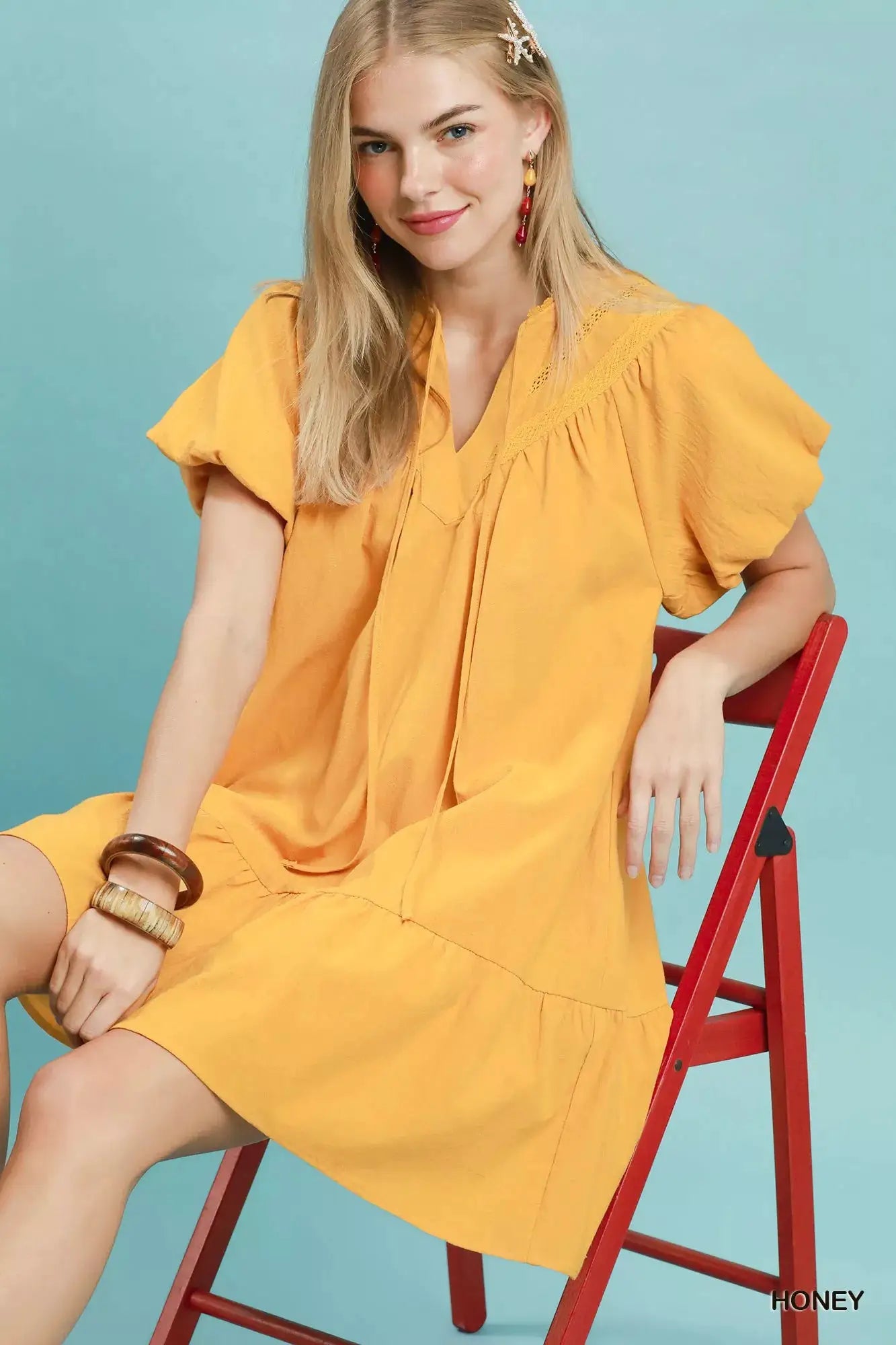 Umgee Flutter Sleeve Tassel Tie Ruffle Hem Mini Dress by Trendsi