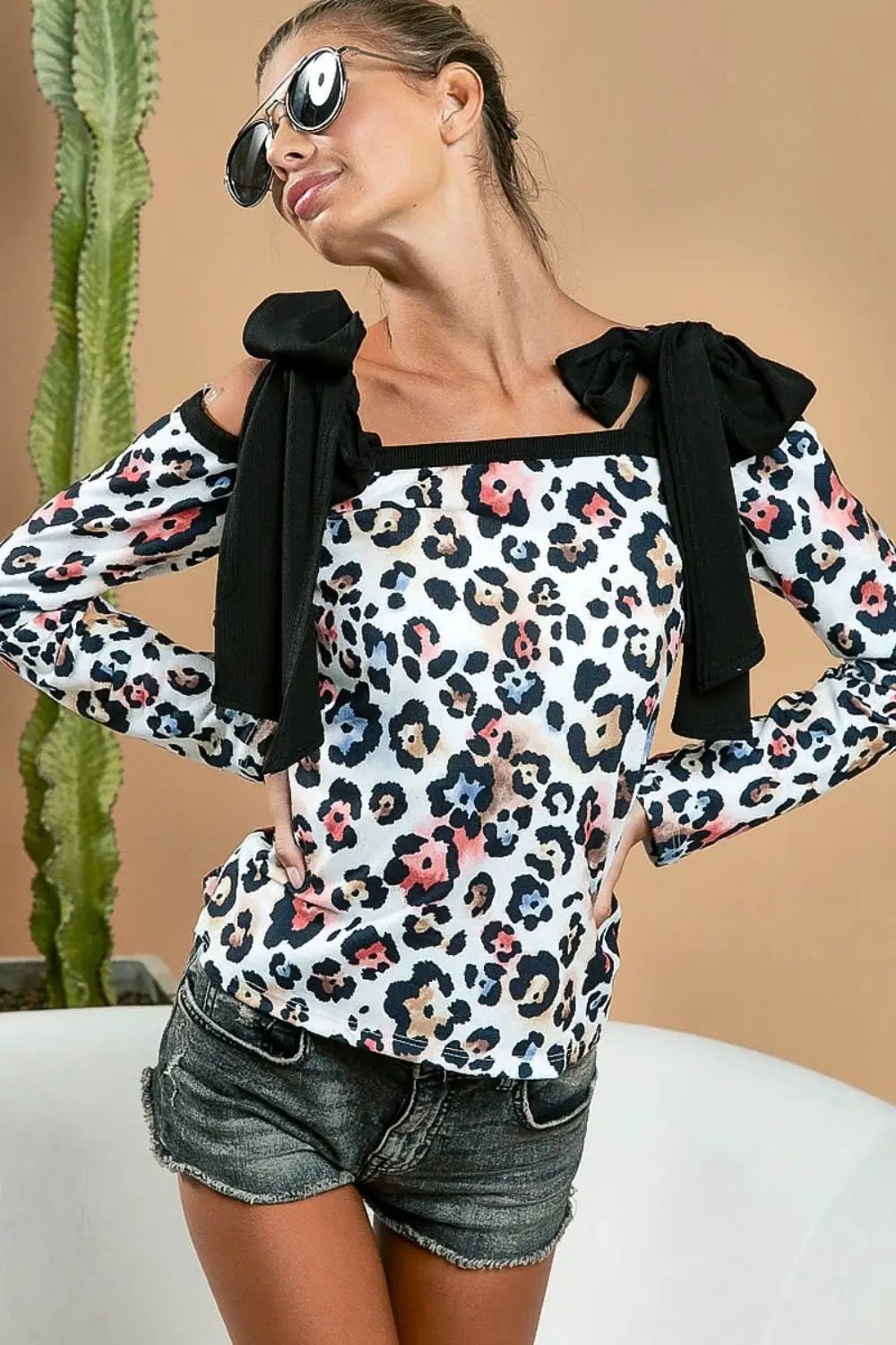 BiBi Leopard Shoulder Tie Long Sleeve Top by Trendsi