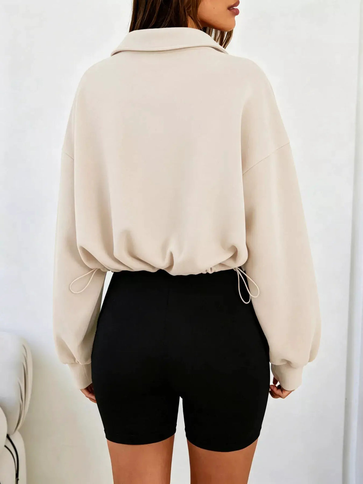 Half Zip Drawstring Hem Sweatshirt by Trendsi