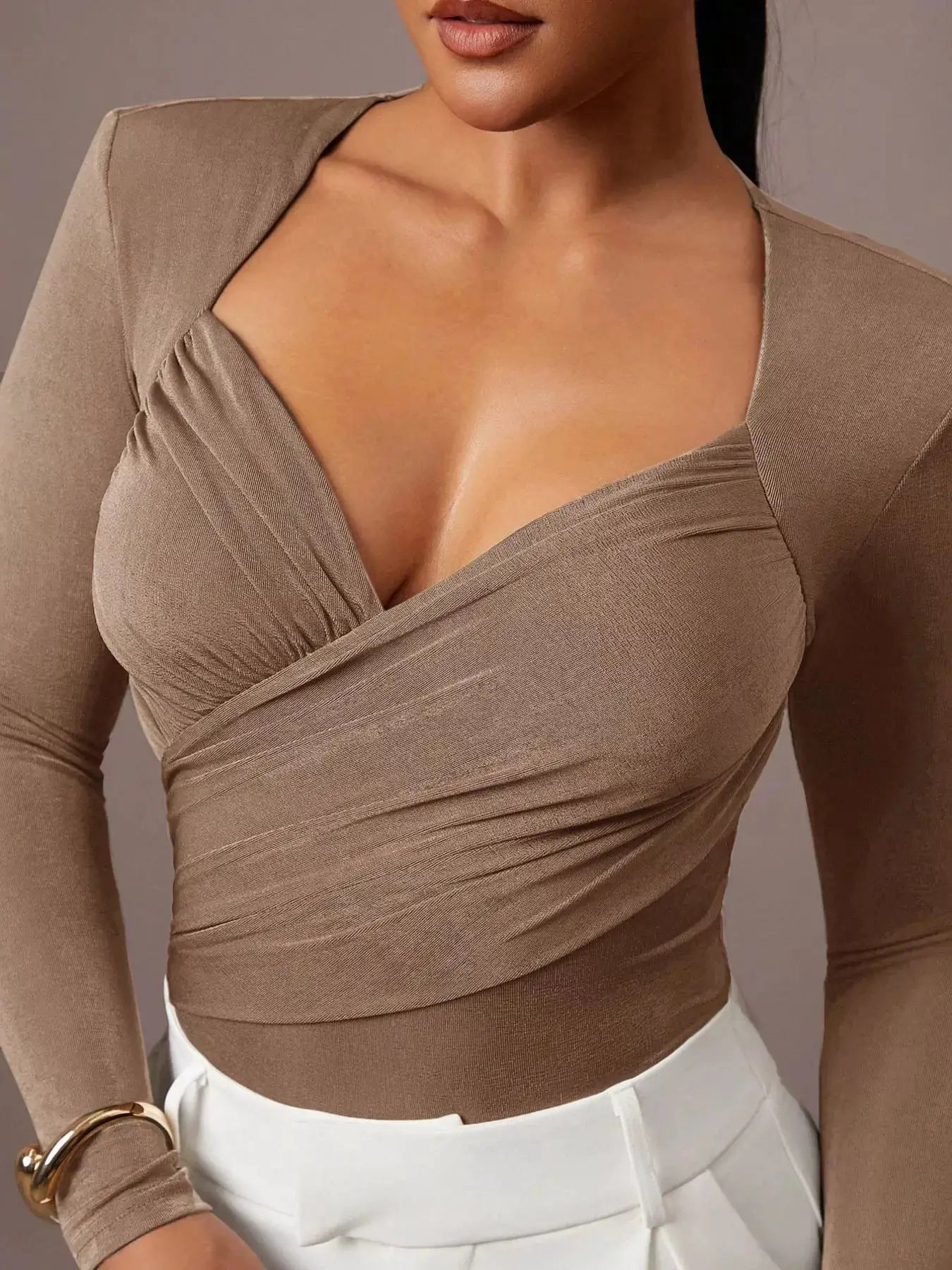 Ruched Surplice Long Sleeve Bodysuit by Trendsi