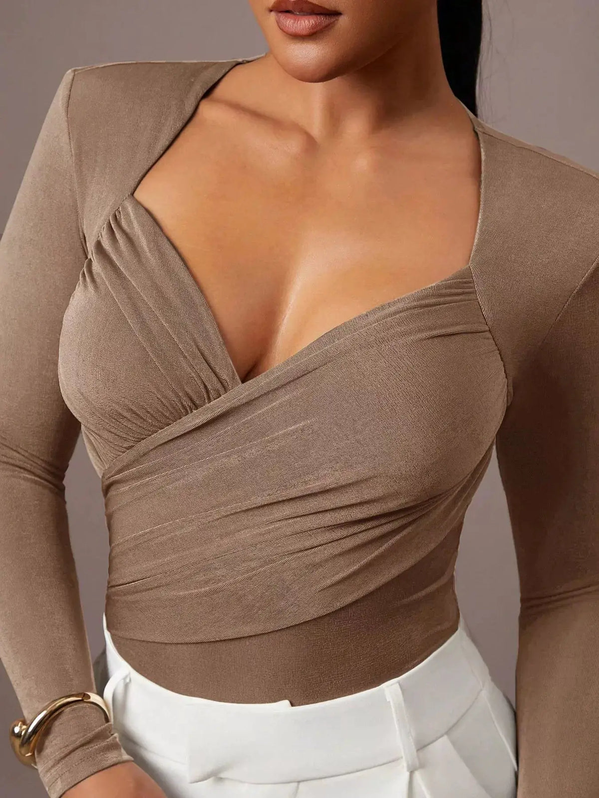 Ruched Surplice Long Sleeve Bodysuit by Trendsi