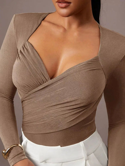 Ruched Surplice Long Sleeve Bodysuit by Trendsi