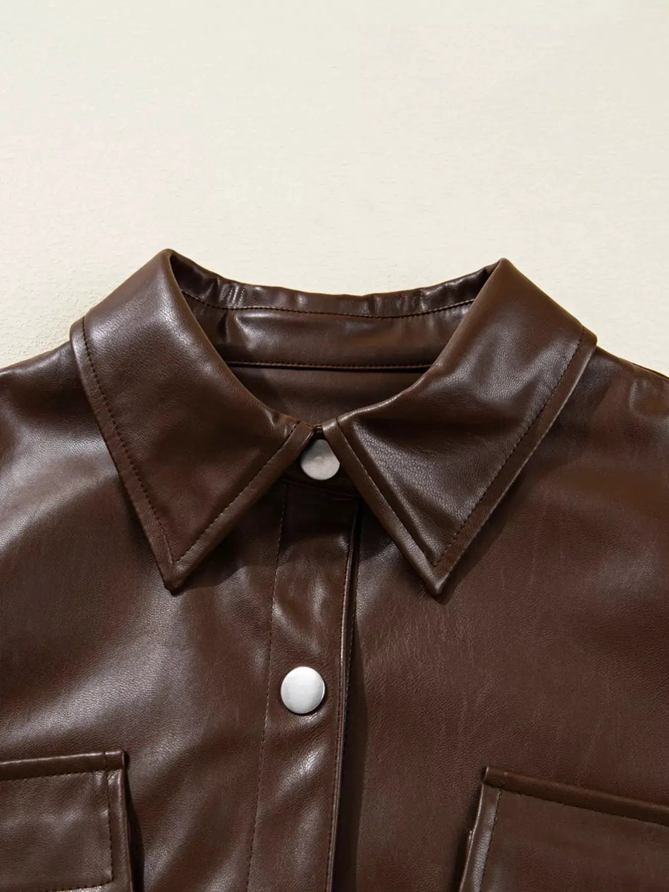 Double Flap Pocket Drawstring Hem Leather Jacket by Trendsi