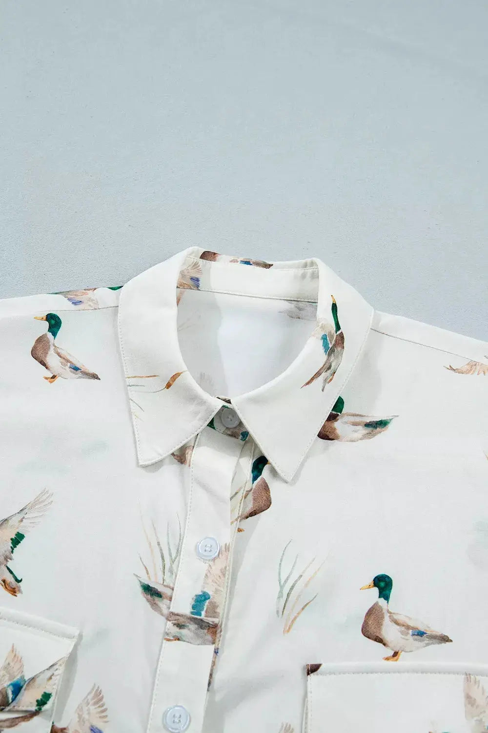 Mallard Printed Button Flap Pocket Short Sleeve Shirt by Trendsi