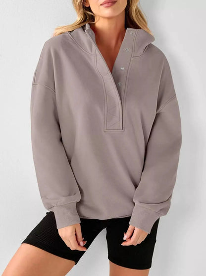 Half Snap Dropped Shoulder Hoodie by Trendsi