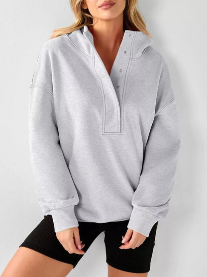 Half Snap Dropped Shoulder Hoodie by Trendsi