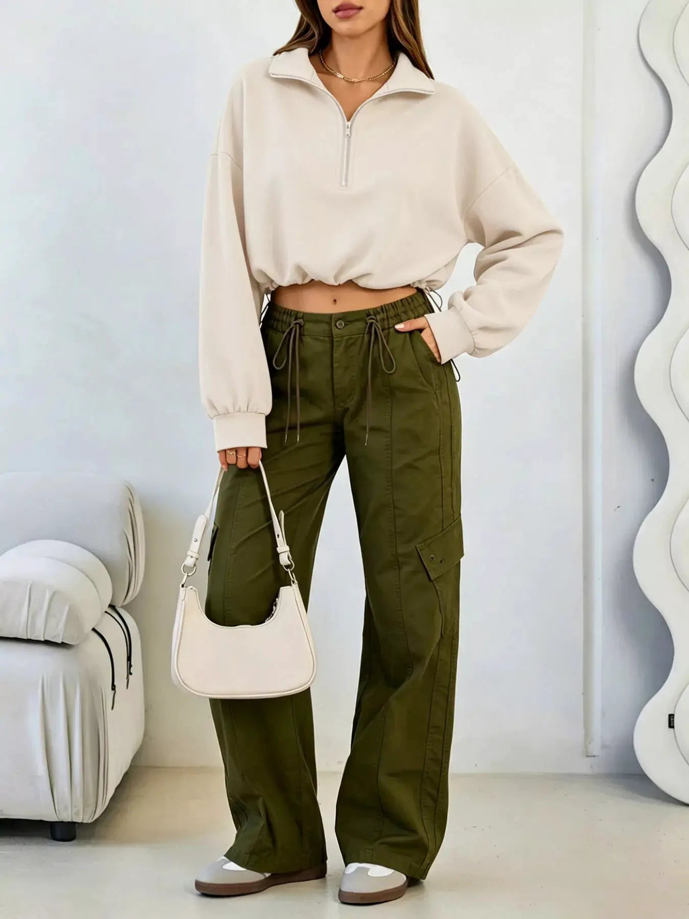 Half Zip Drawstring Hem Sweatshirt by Trendsi