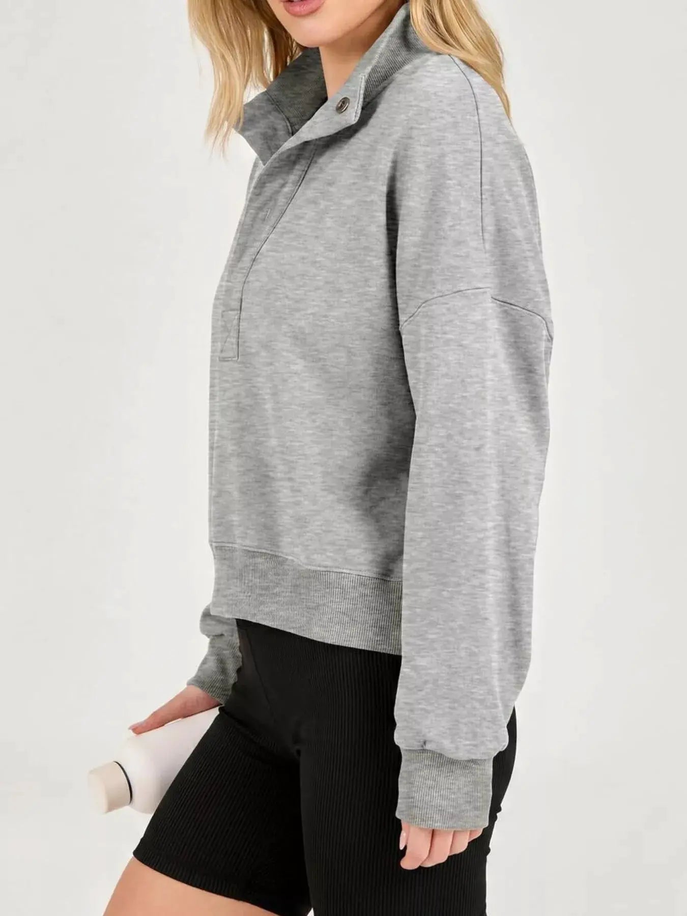 Half Snap Dropped Shoulder Sweatshirt by Trendsi