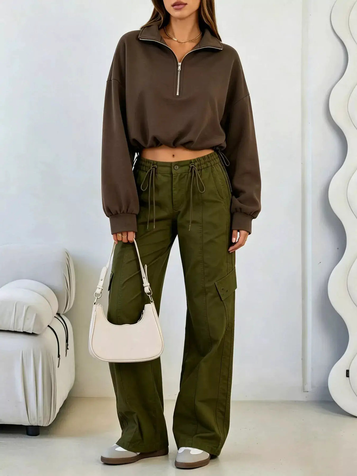 Half Zip Drawstring Hem Sweatshirt by Trendsi
