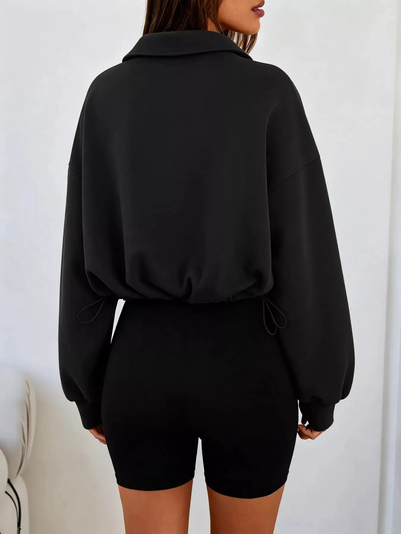 Half Zip Drawstring Hem Sweatshirt by Trendsi