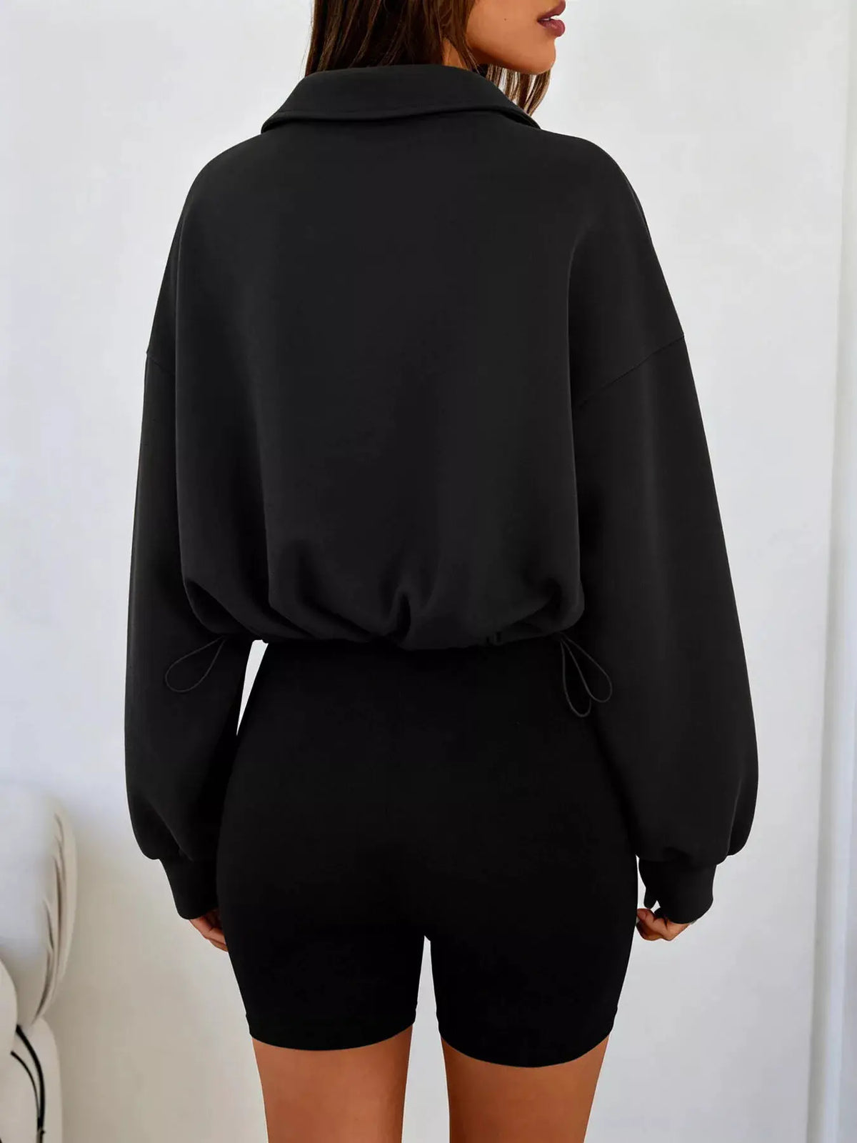 Half Zip Drawstring Hem Sweatshirt by Trendsi
