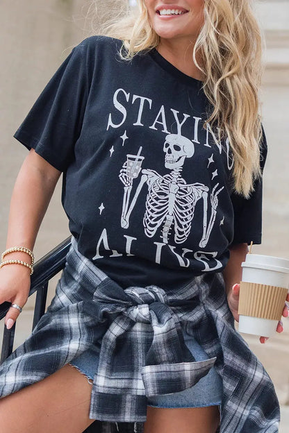 STAYING ALIVE Funny Skeleton Graphic Round Neck T Shirt by Trendsi