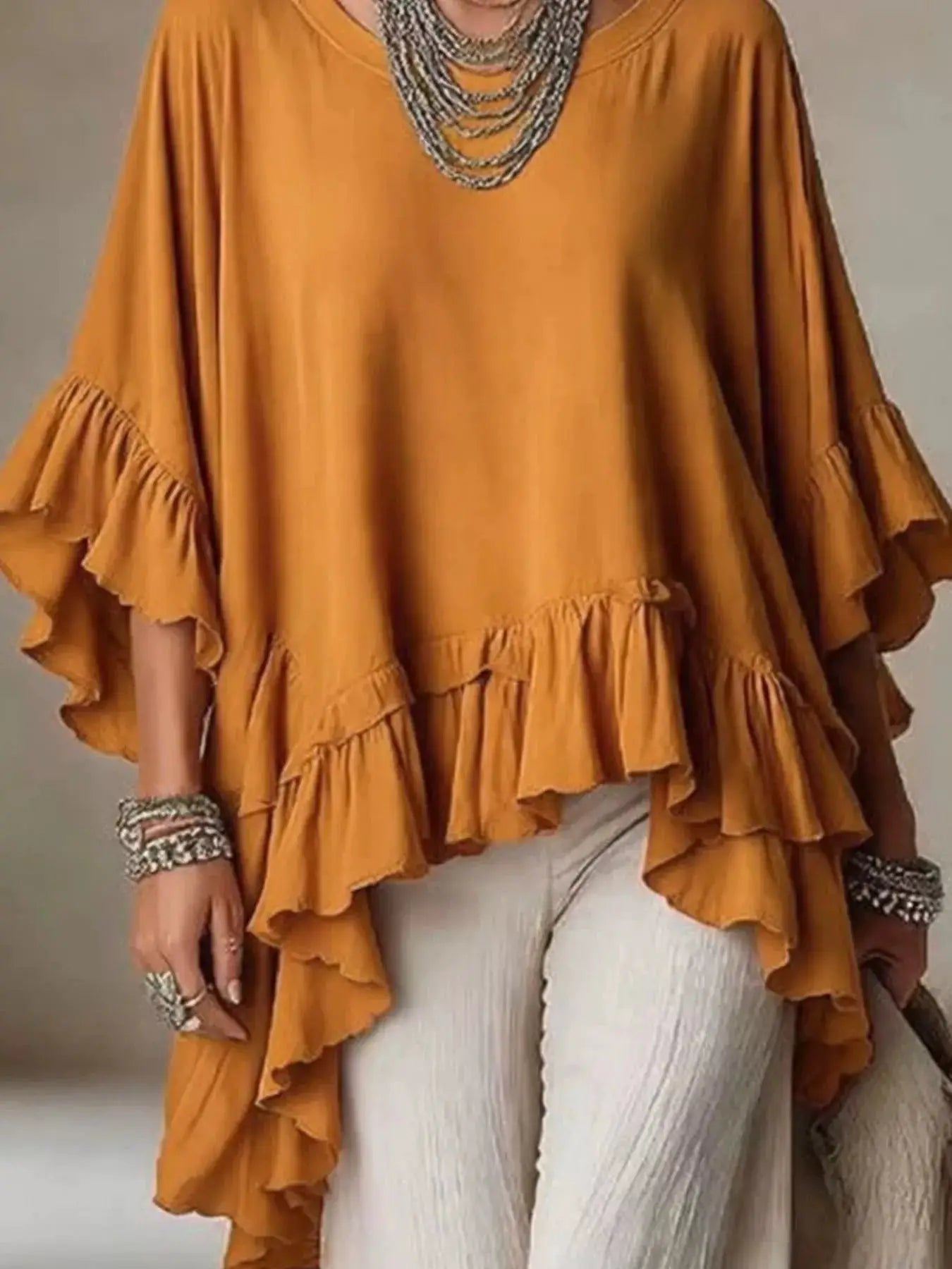 Ruffled Hem Loose Fit Top by Trendsi