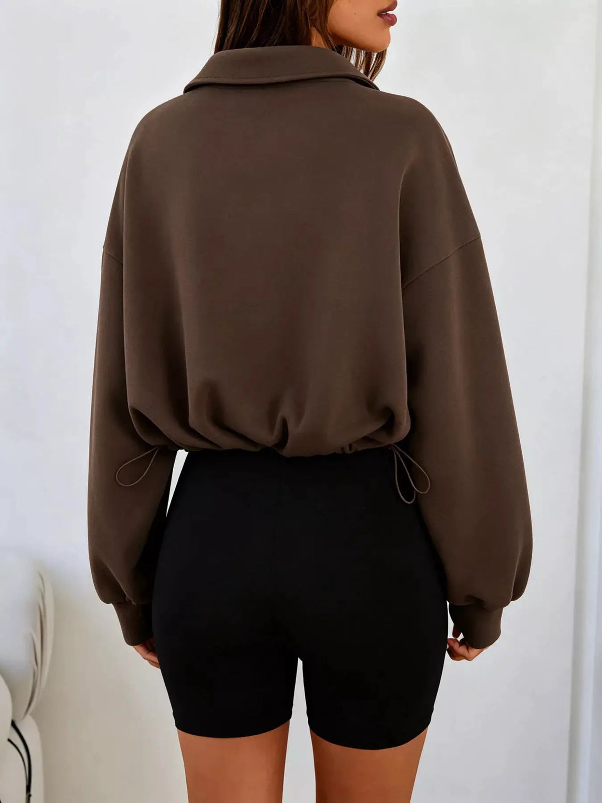Half Zip Drawstring Hem Sweatshirt by Trendsi