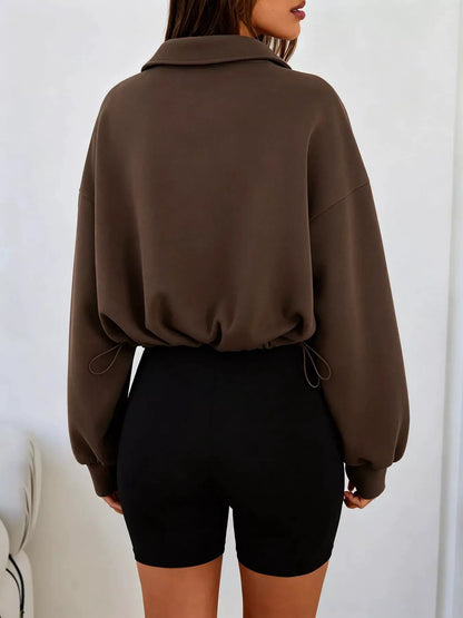 Half Zip Drawstring Hem Sweatshirt by Trendsi