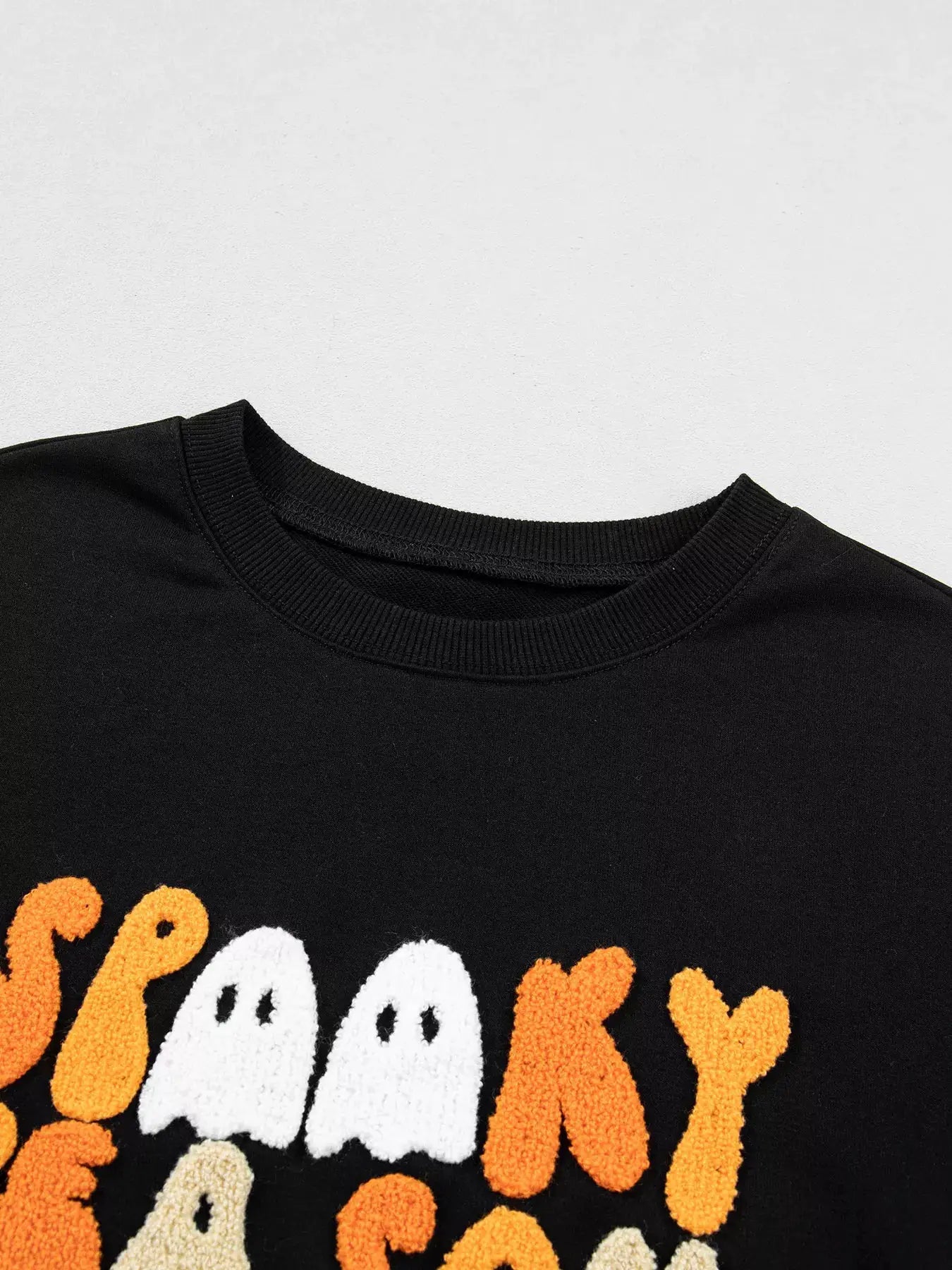 Embroidered Spooky Season Long Sleeve Round Neck Sweatshirt by Trendsi
