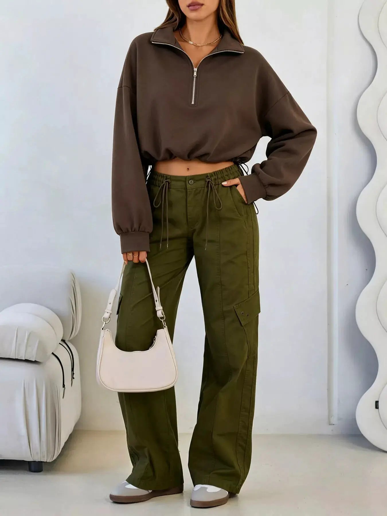 Half Zip Drawstring Hem Sweatshirt by Trendsi