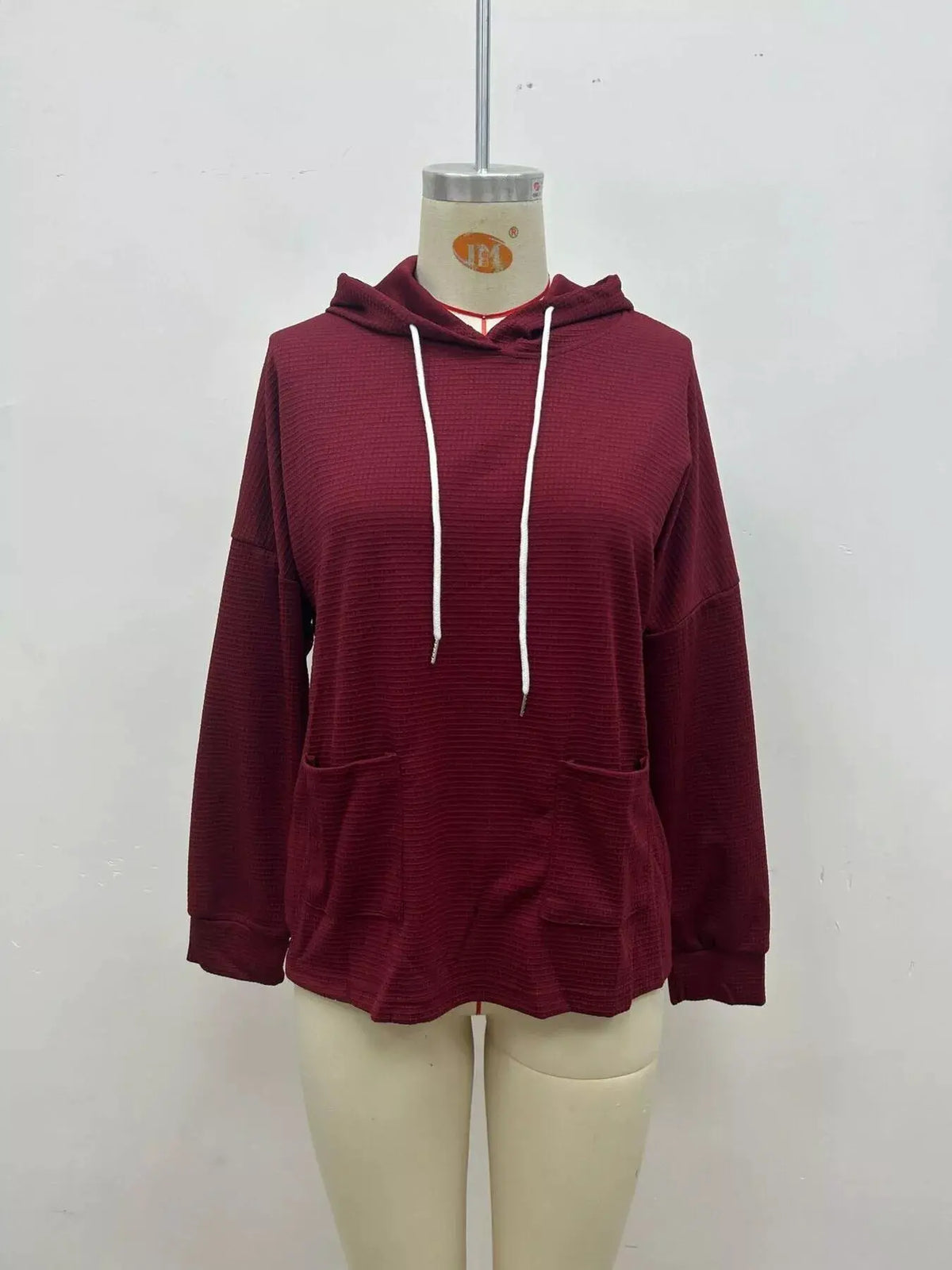 Full Size Waffle Knit Drawstring Long Sleeve Hoodie Plus Size by Trendsi