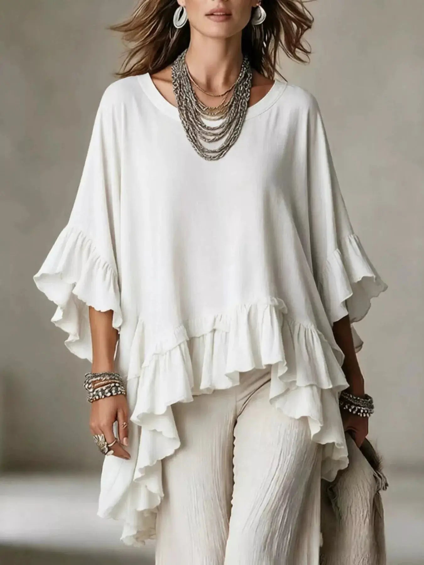 Ruffled Hem Loose Fit Top by Trendsi