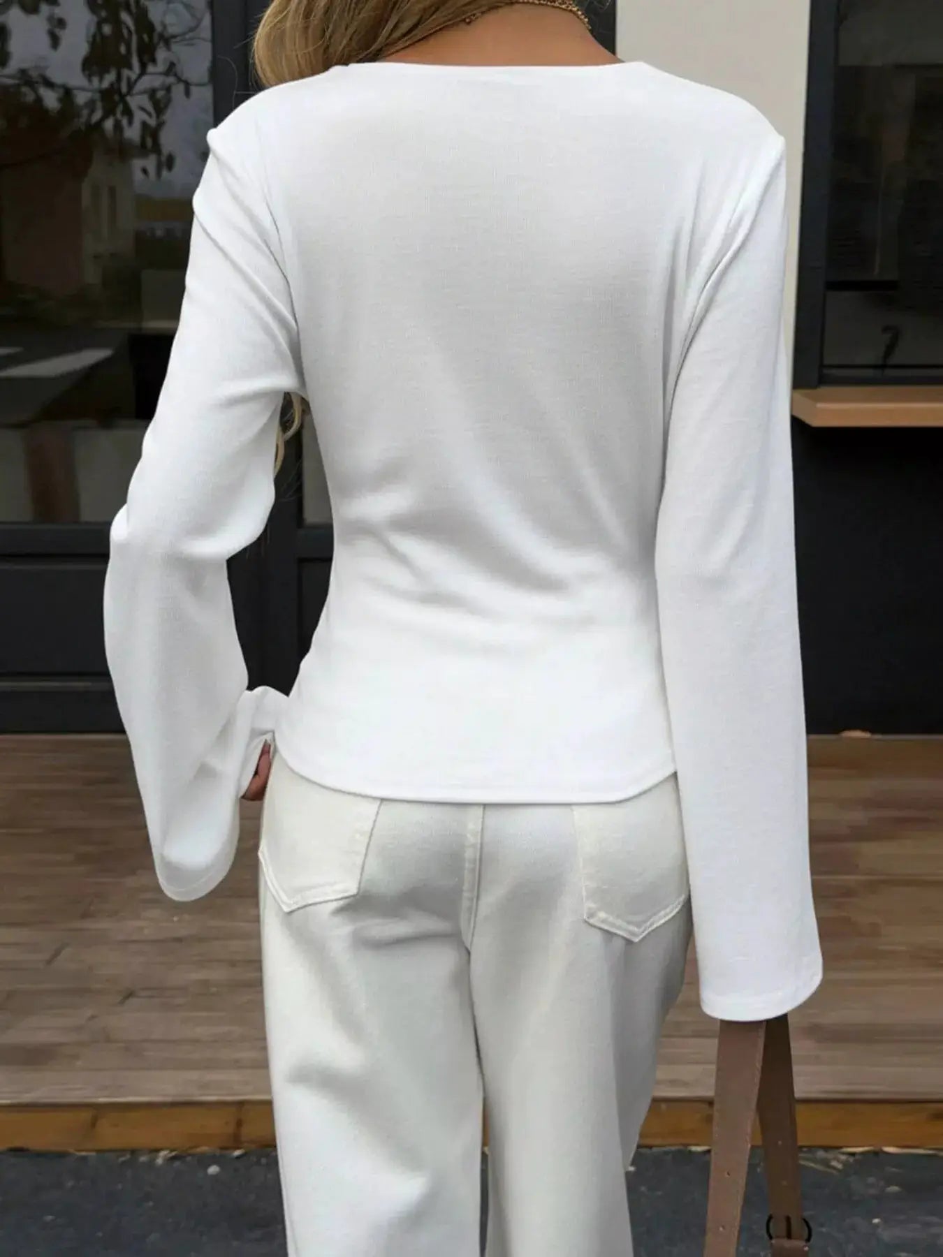 Elegant V-Neck Wrap Asymmetrical Blouse with Flared Sleeves by Trendsi