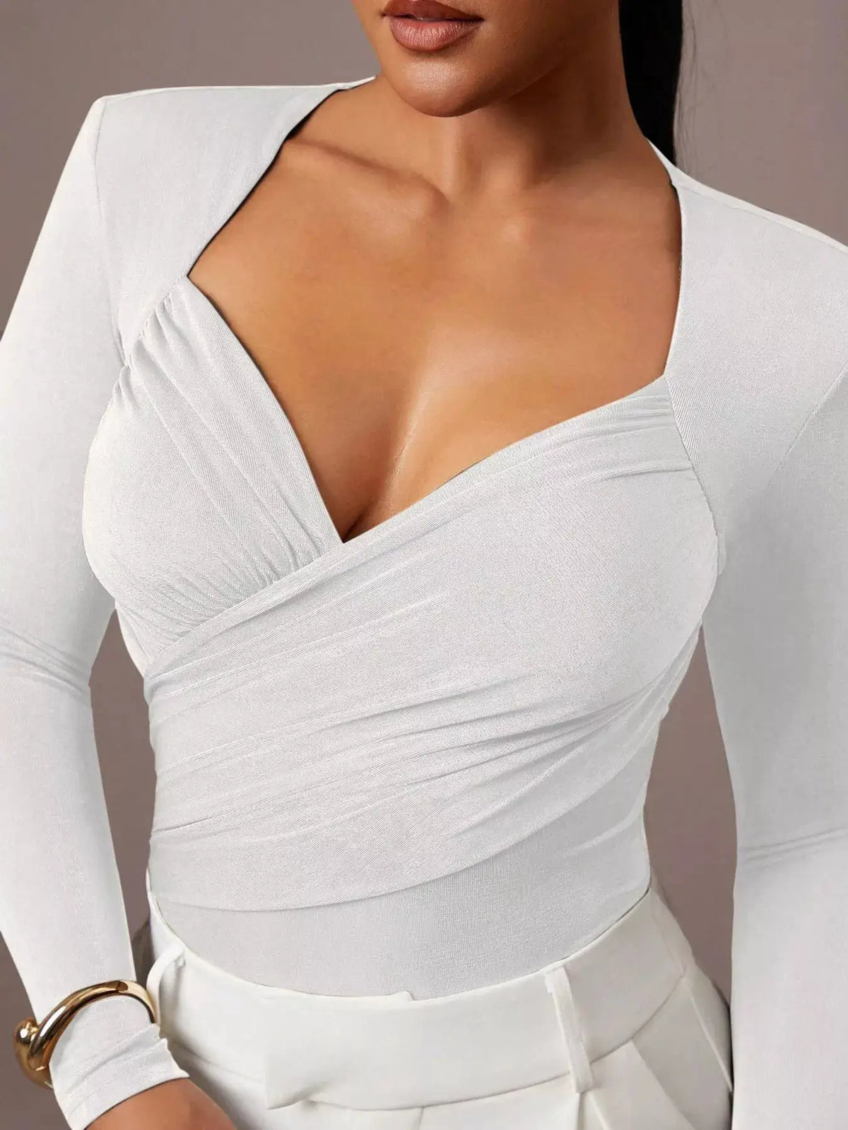 Ruched Surplice Long Sleeve Bodysuit by Trendsi