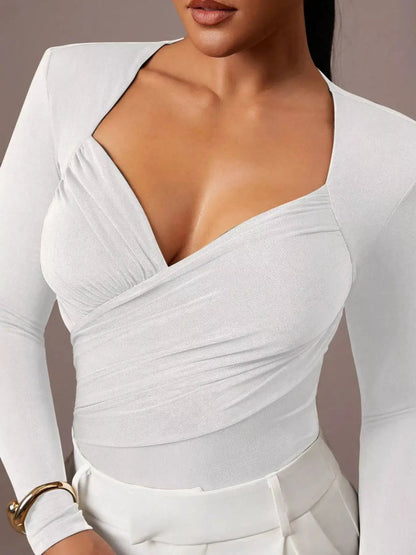 Ruched Surplice Long Sleeve Bodysuit by Trendsi