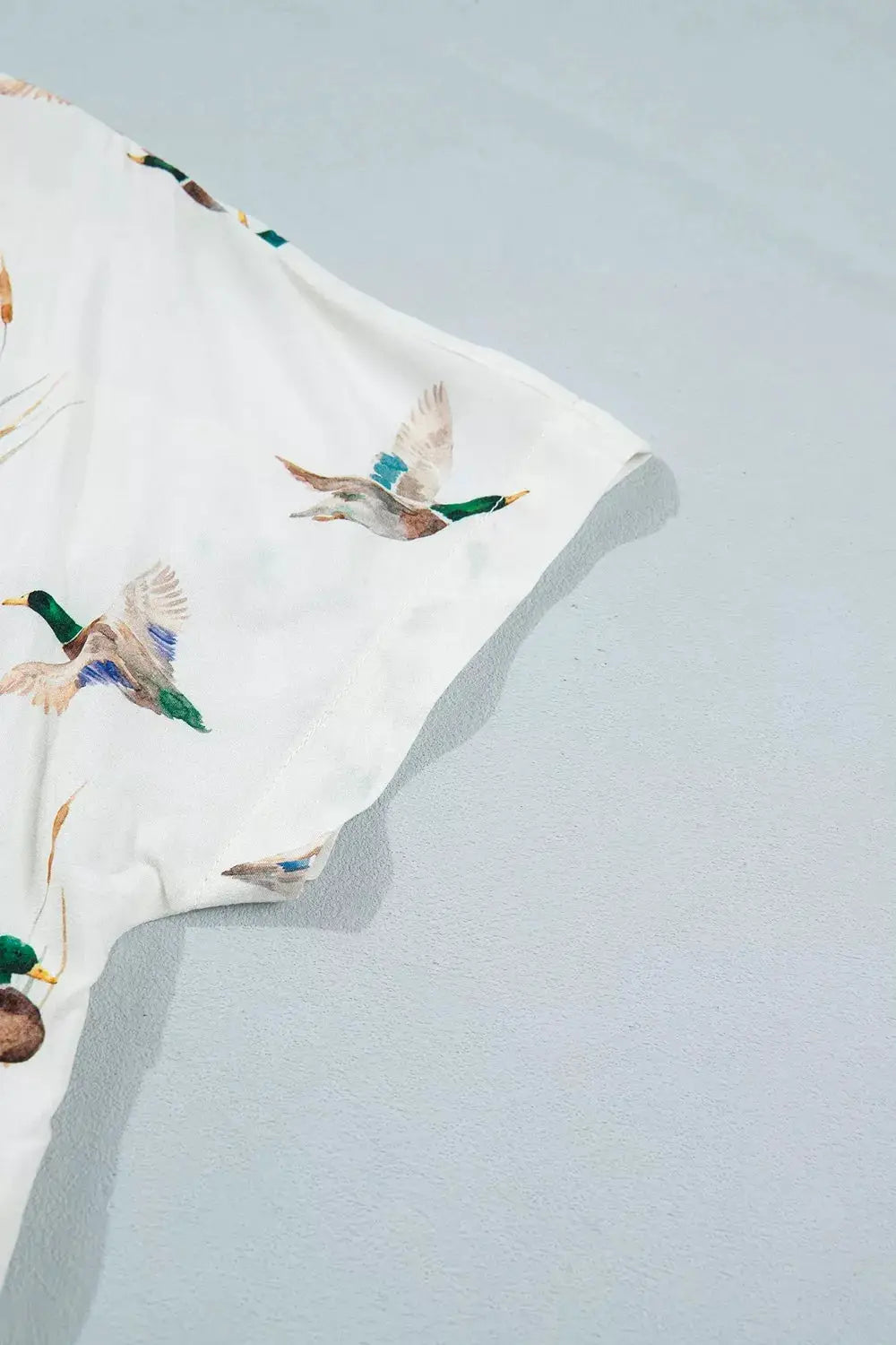 Mallard Printed Button Flap Pocket Short Sleeve Shirt by Trendsi