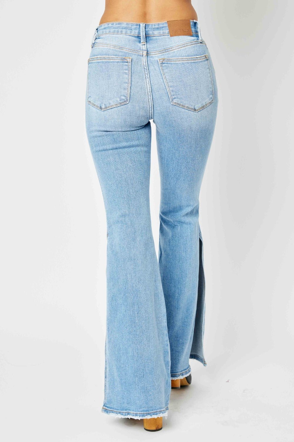 Judy Blue Full Size Mid Rise Raw Hem Slit Flare Jeans - Bitsy Gypsy Boutique