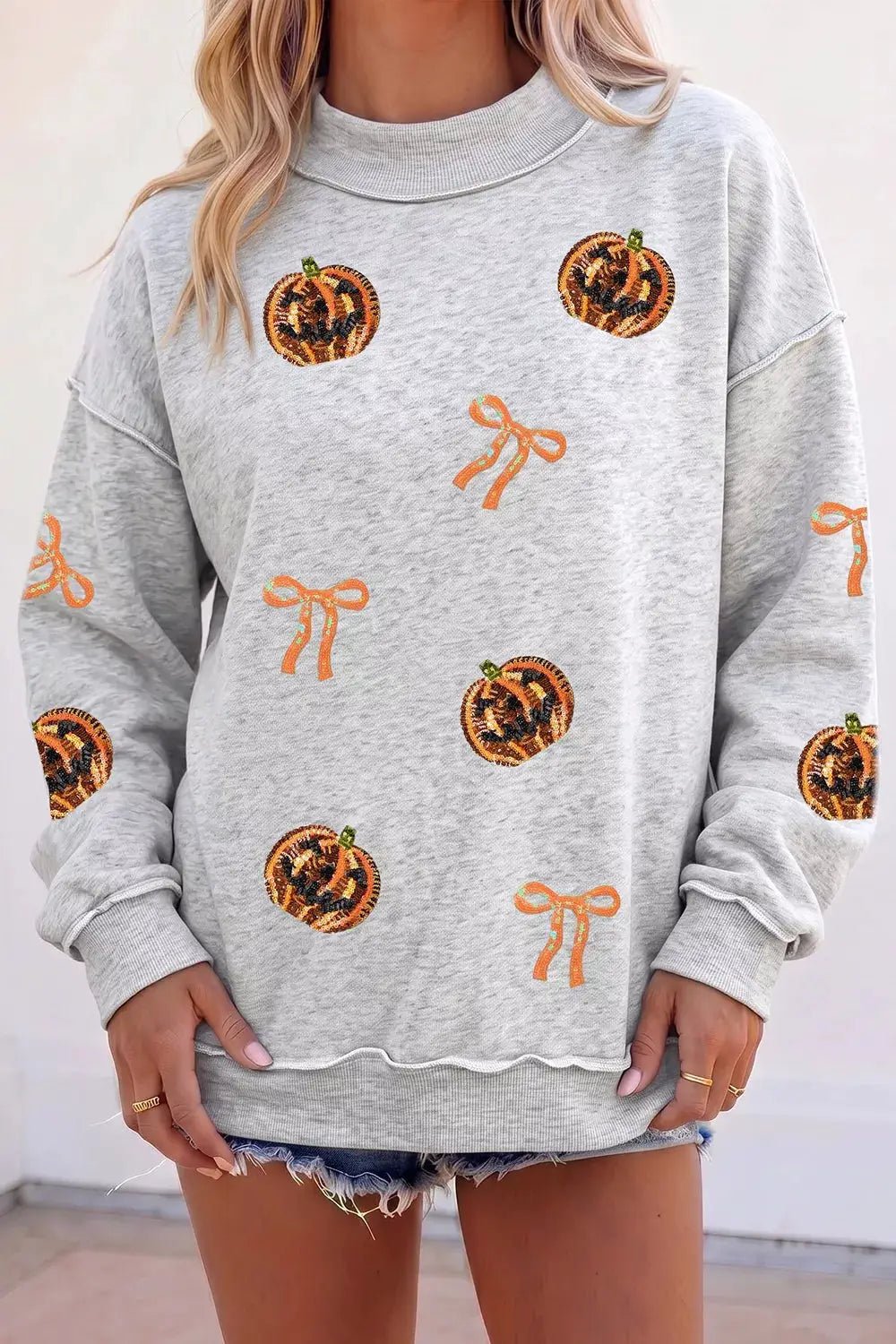 Sequin Pumpkin Face Bow Exposed Seam Halloween Sweatshirt - Bitsy Gypsy Boutique