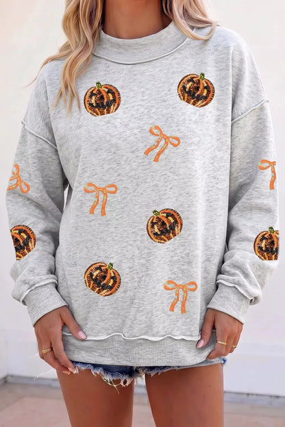 Sequin Pumpkin Face Bow Exposed Seam Halloween Sweatshirt - Bitsy Gypsy Boutique