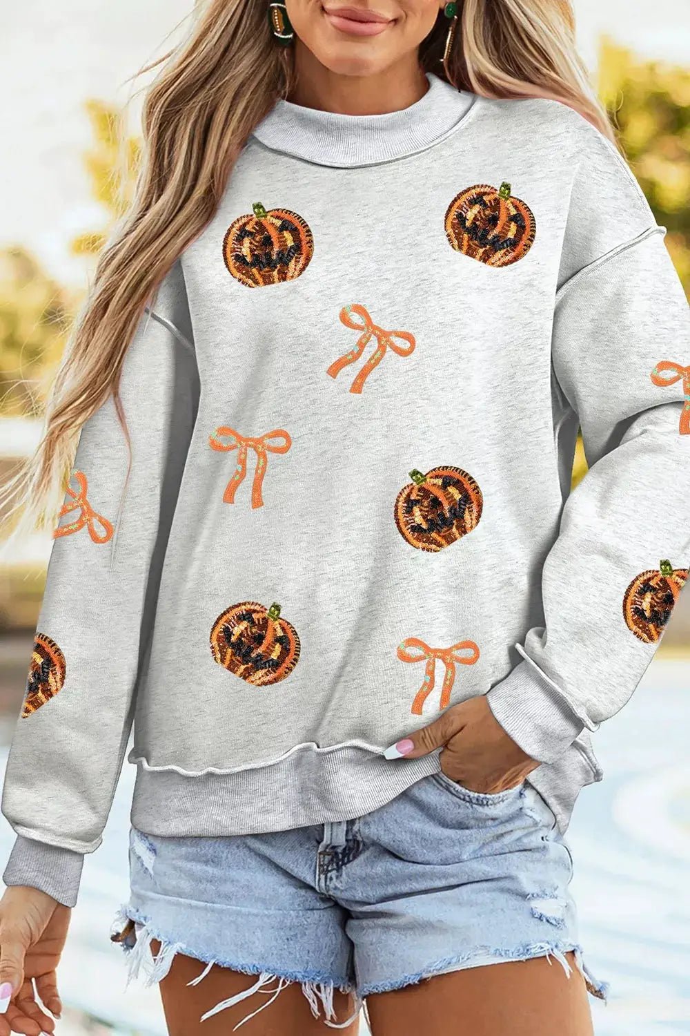 Sequin Pumpkin Face Bow Exposed Seam Halloween Sweatshirt - Bitsy Gypsy Boutique