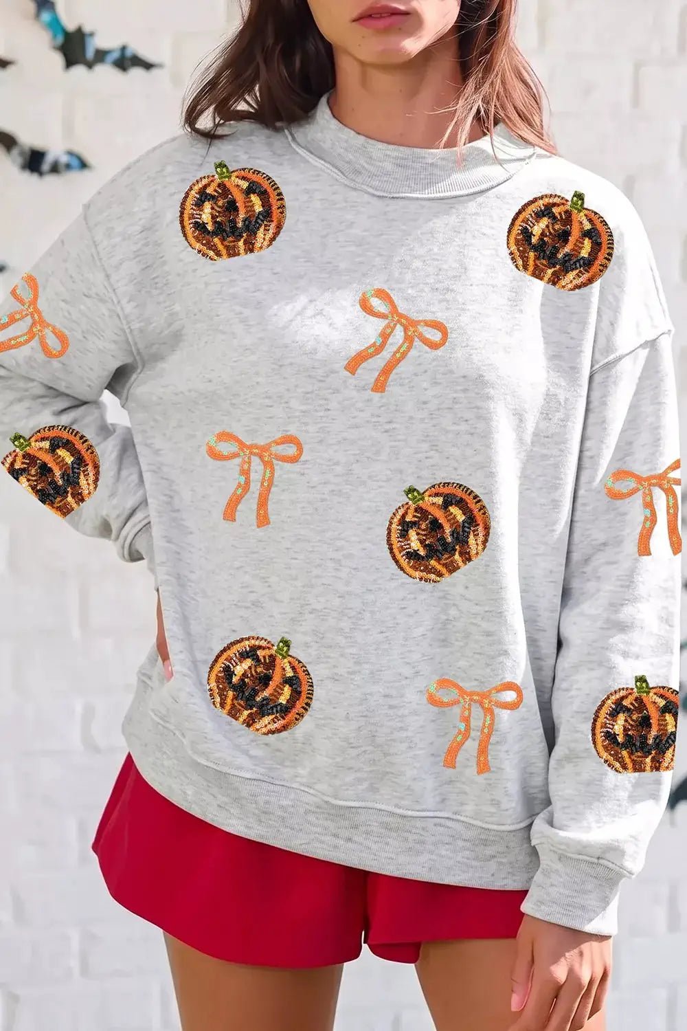 Sequin Pumpkin Face Bow Exposed Seam Halloween Sweatshirt - Bitsy Gypsy Boutique